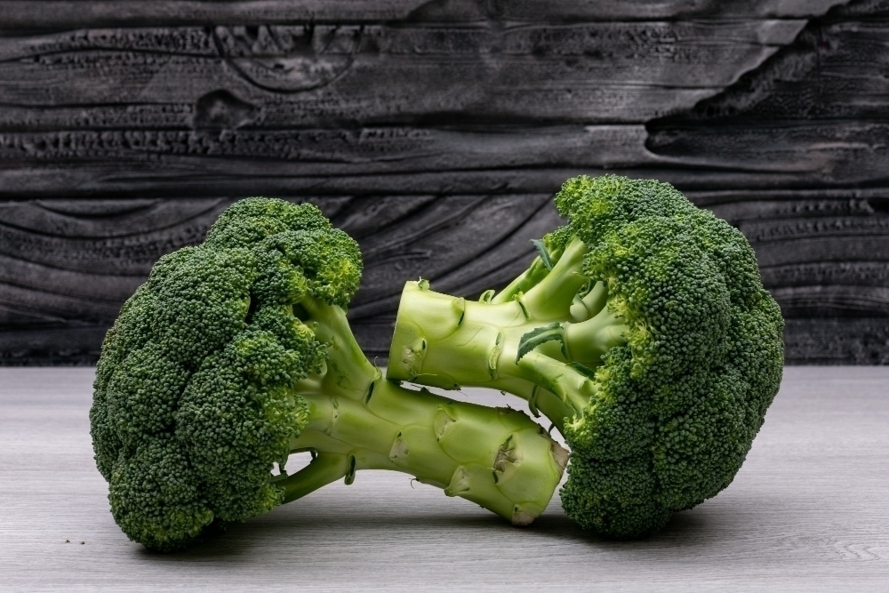 Fresh broccoli on white wood table
