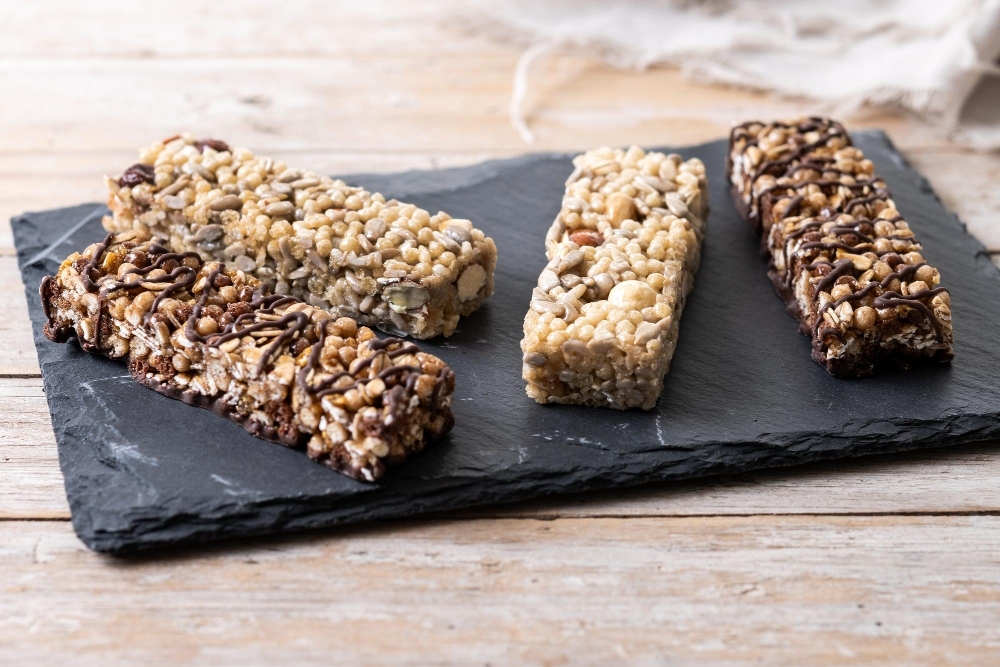 Healthy Muesli bar with nuts and seeds on wooden table