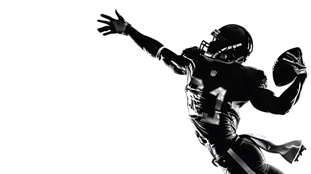 Silhouette of a Football Player Reaching for the Ball in the Air