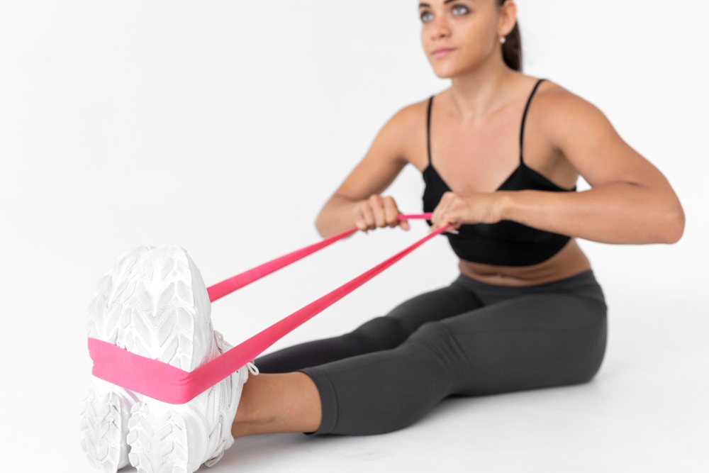 Woman working out alone with resistance band