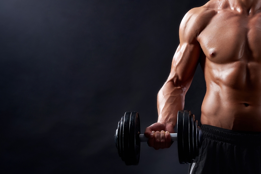 Young fitness man in studio